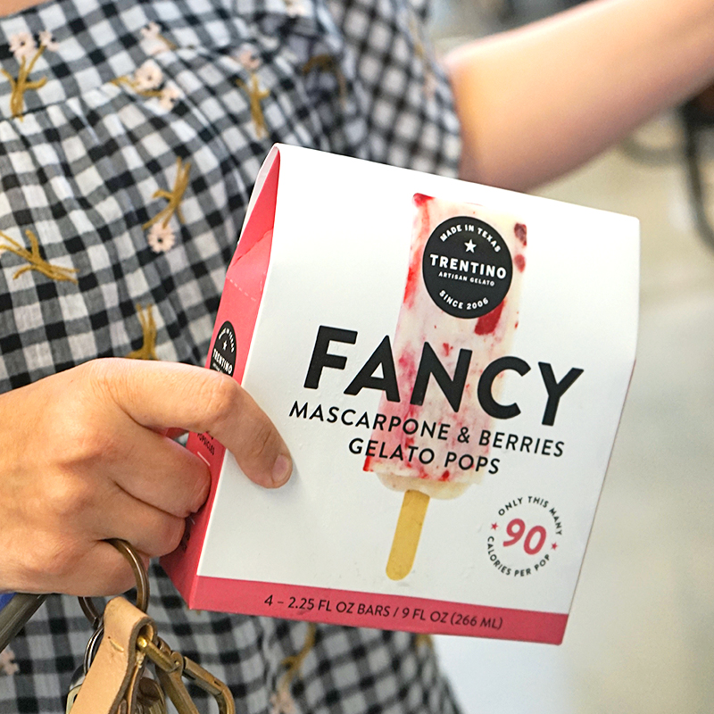 Someone carrying the Fancy mascarpone and berries Trentino gelato pops box