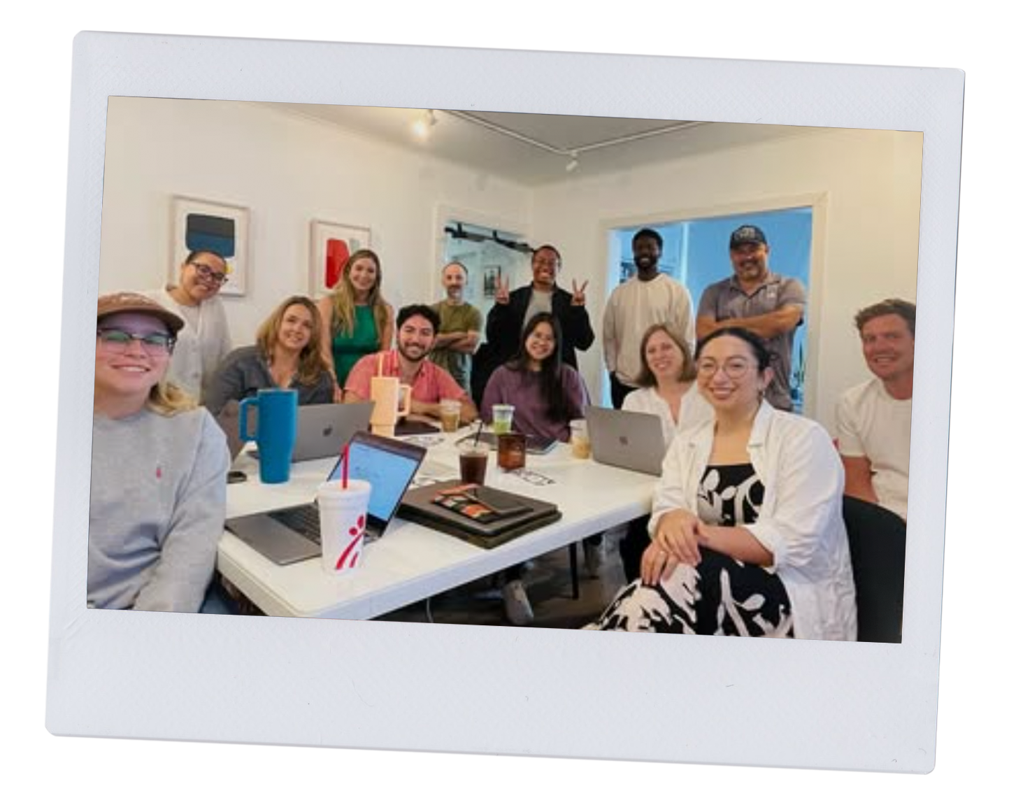The 5+8 team gathered around the table in the studio